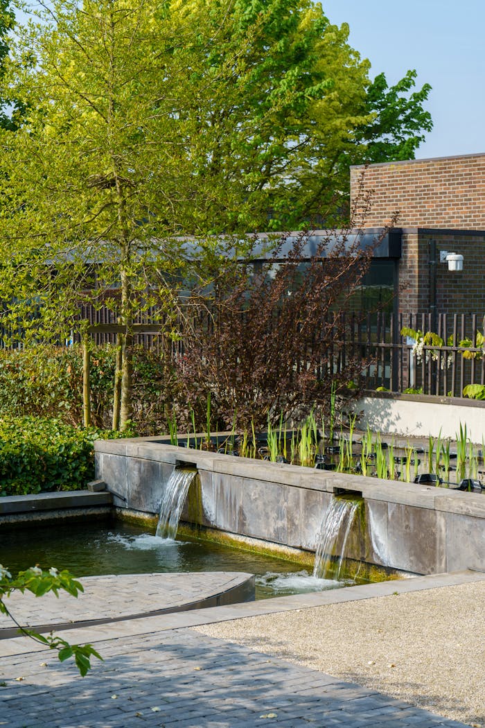 Serene view of a contemporary garden fountain with flowing water in Geel, Belgium.